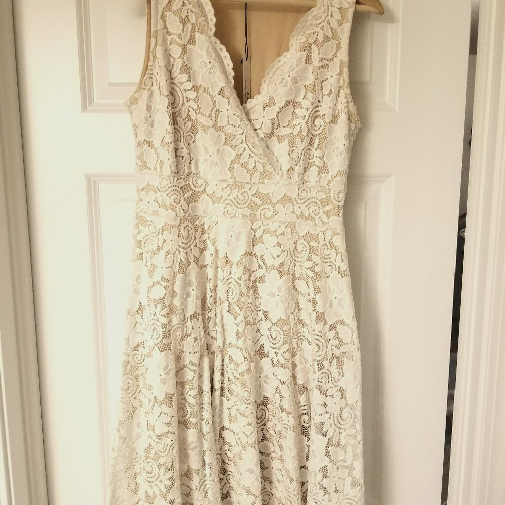 Gorgeous Patty Boutik size M knee length A-line white floral dress with tan slip
